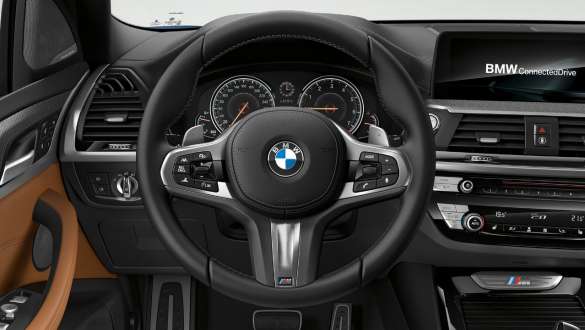 BMW X3 M40i et BMW X3 M40d, volant M en cuir. Intérieur des BMW X3 M40i et BMW X3 M40d, habitacle avec volant M en cuir.